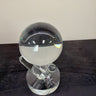 Two glass spheres, one intact and one shattered