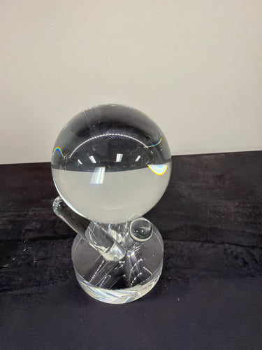 Two glass spheres, one intact and one shattered