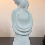 Abstract sculpture of two figures embracing