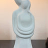 Abstract sculpture of two figures embracing