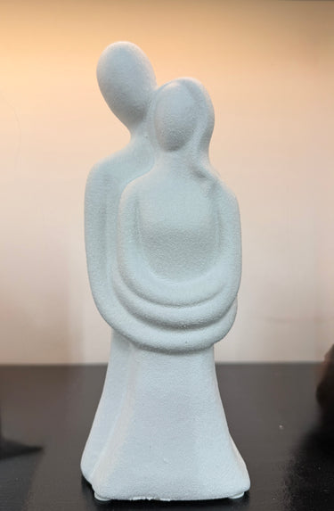 Abstract sculpture of two figures embracing