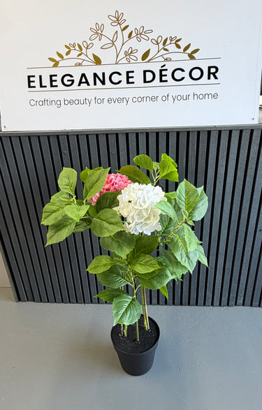 Artificial plant with pink and white flowers in a pot
