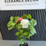Artificial plant with pink and white flowers in a pot 